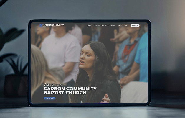 Tablet shows the Carbon Community Baptist Church website; a woman prays in a worship setting with a blurred crowd in the background.