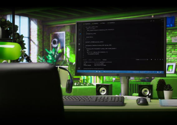 Monitor displays code on a neon-green themed desk with a keyboard, headphones, and plants in the background.